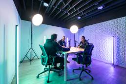 3 guys in a podcast room