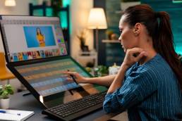 a studio editor doing retoucher work on touch screen