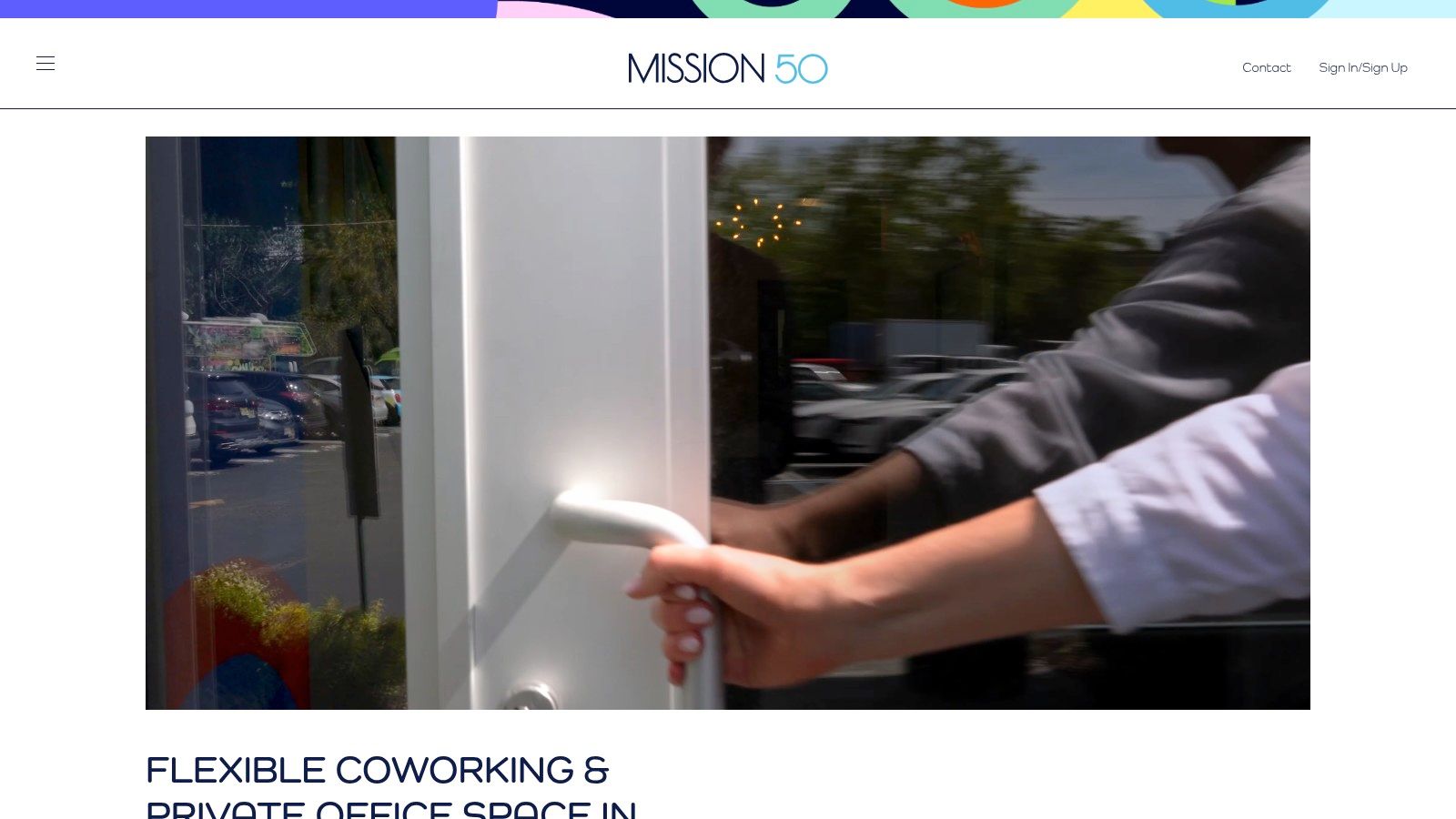 A door opens into a modern and bright coworking office space, symbolizing opportunity for Hoboken NJ businesses.